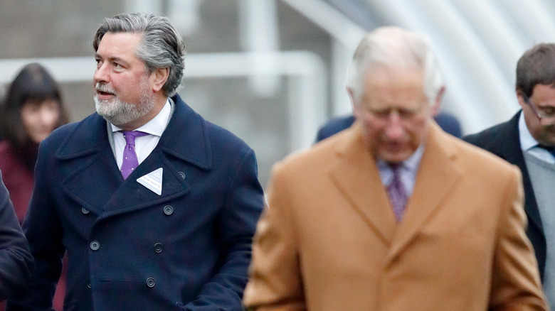 Prince Charles with aide Michael Fawcett walking outside