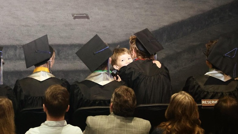 Drake and Crew Gaines embracing at Drake's graduation