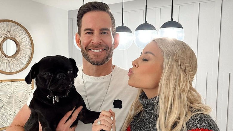 tarek el moussa smiling with wife 