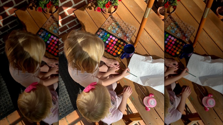 Top down view of the Napier children painting together