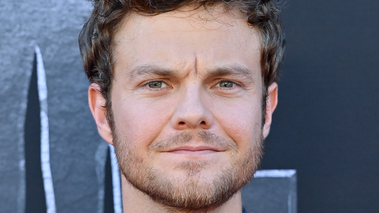 Jack Quaid posing on the red carpet