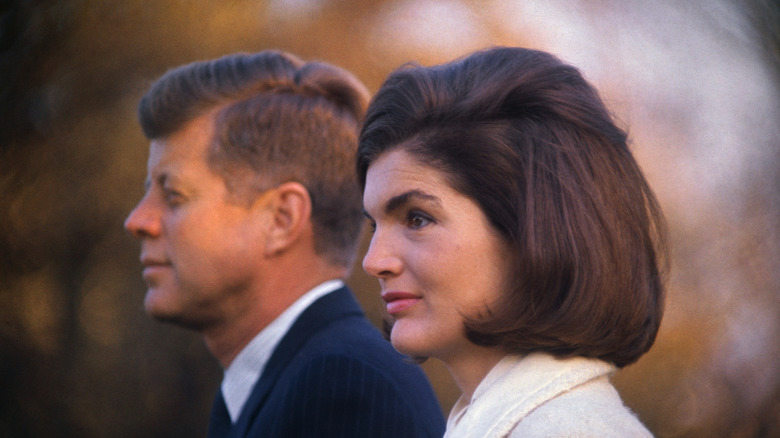 John F. Kennedy and Jackie Kennedy photographed outside