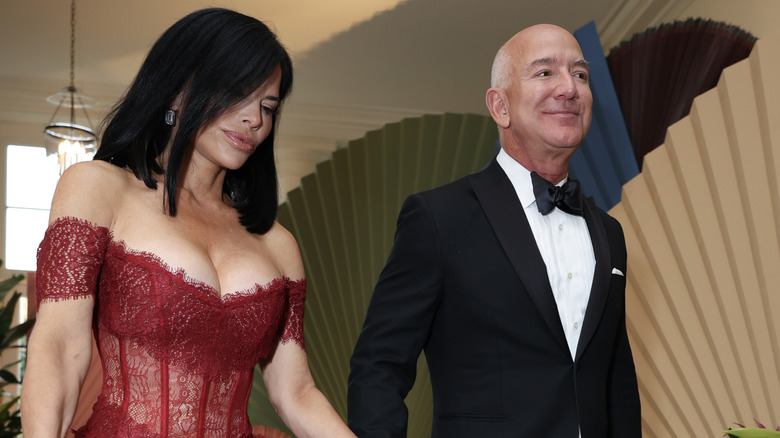 Jeff Bezos and Lauren Sanchez walking