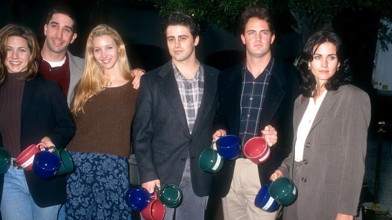 Cast of Friends poing together