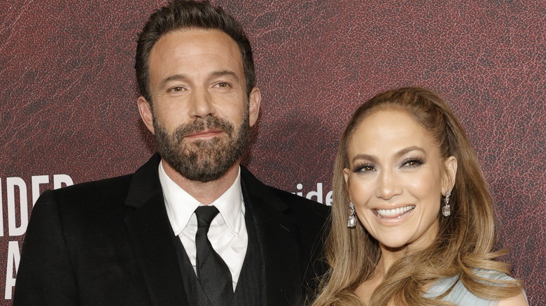 Ben Affleck & Jennifer Lopez smiling together at an event