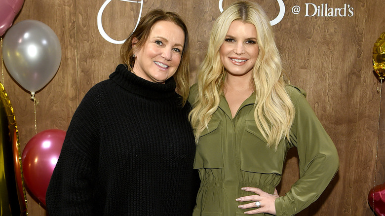 Tina Ann Drew and Jessica Simpson at event