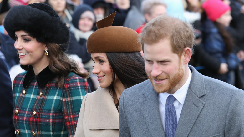 Princess Catherine and Prince Harry smiling with their spouses 