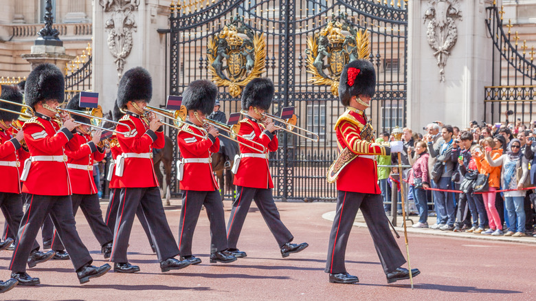 Grenadier Guards marching outside Buckingham Palace