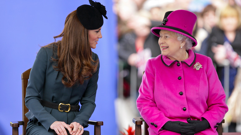 Kate Middleton and Queen Elizabeth smiling and talking