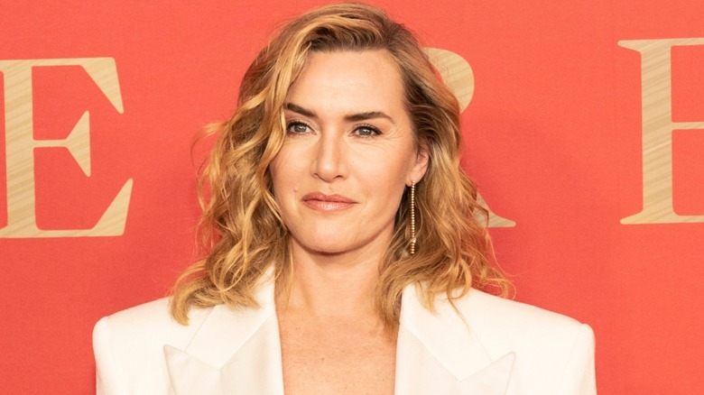 Kate Winslet in a white suit on the red carpet