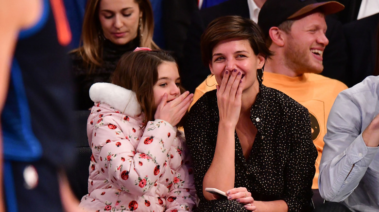 Suri Cruise and Katie Holmes laughing 