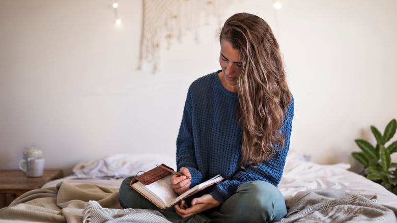 Woman writing in a journal