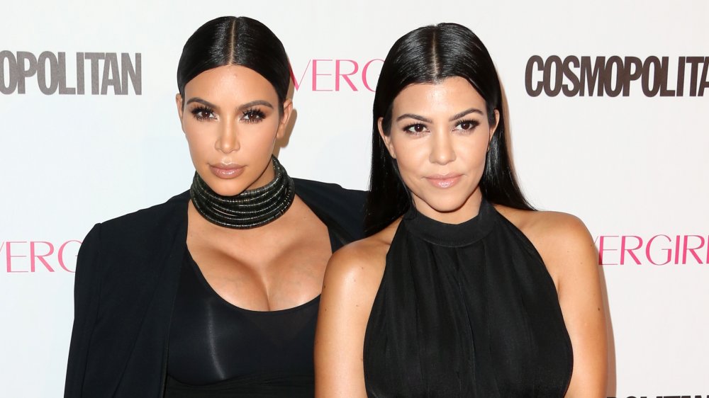 Kim and Kourtney Kardashian on the red carpet in 2015