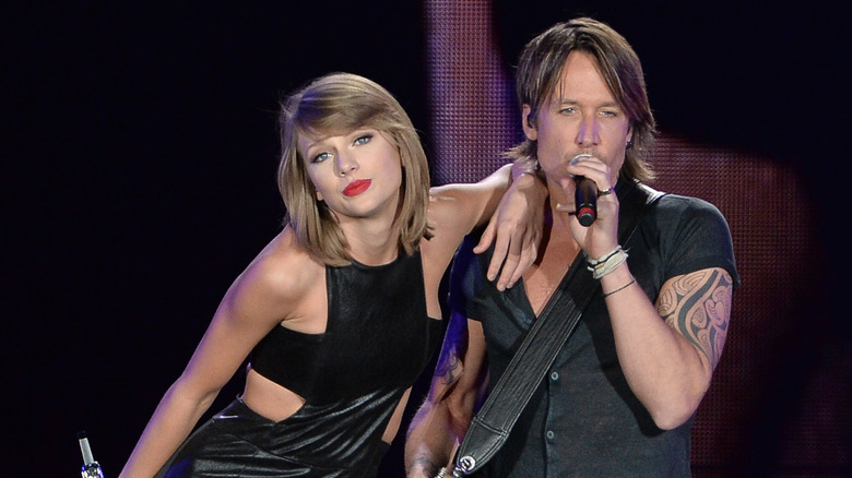 Keith Urban and Taylor Swift performing