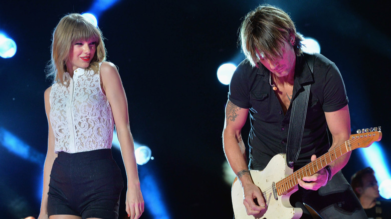 Keith Urban and Taylor Swift performing