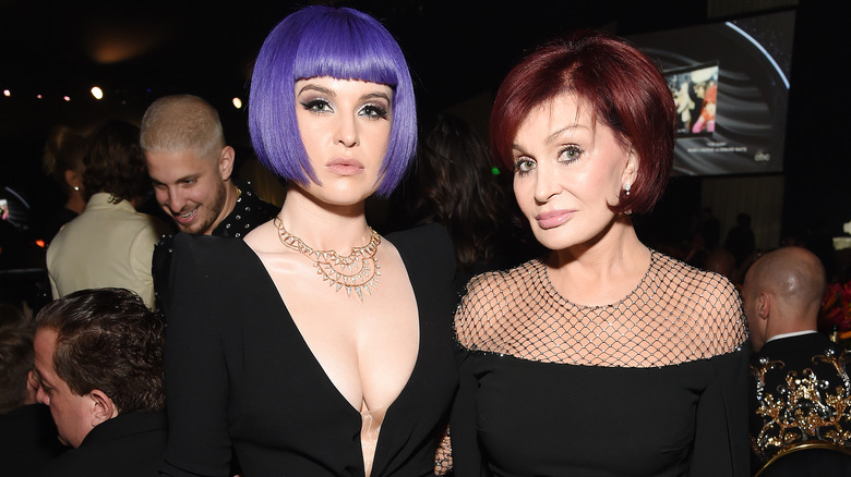 Kelly Osbourne and Sharon Osbourne posing at event