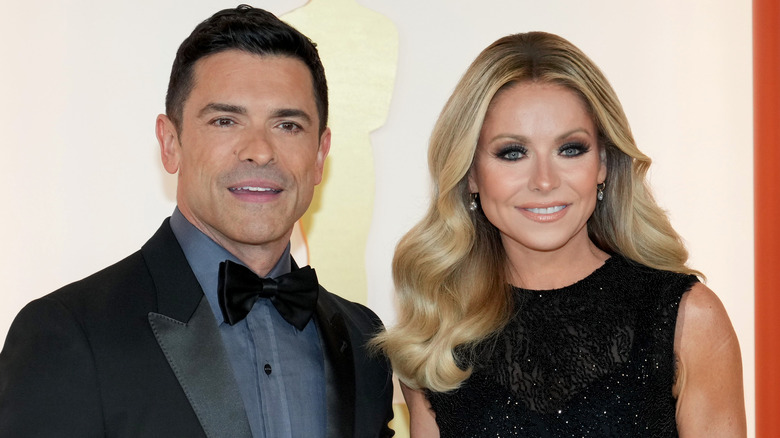 Kelly Ripa and Mark Consuelos posing