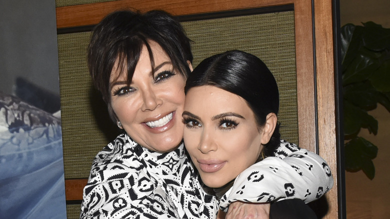 Kris Jenner hugs Kim Kardashian. 