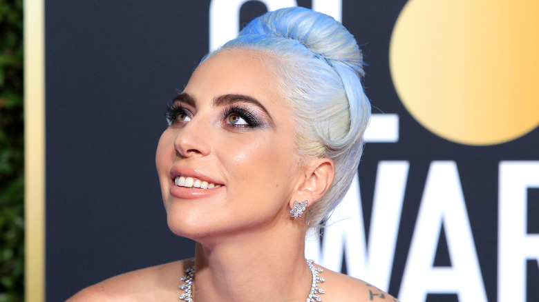 Lady Gaga smiling on the red carpet