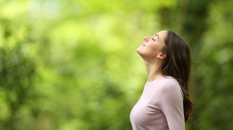 woman breathing outdoor air