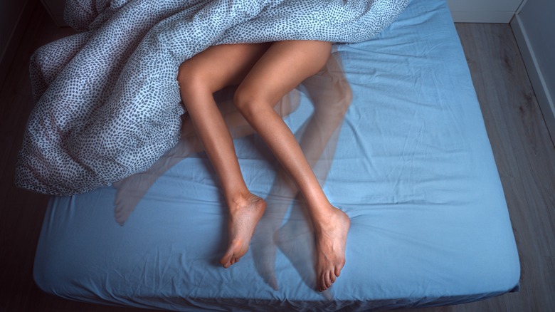 woman's legs in bed