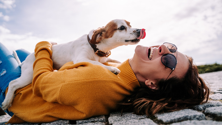 woman playing with a dog