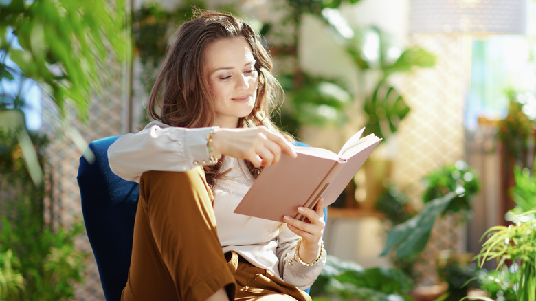 A woman reading a book. 