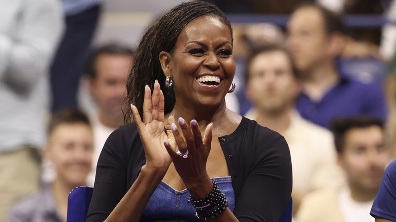 Michelle Obama clapping