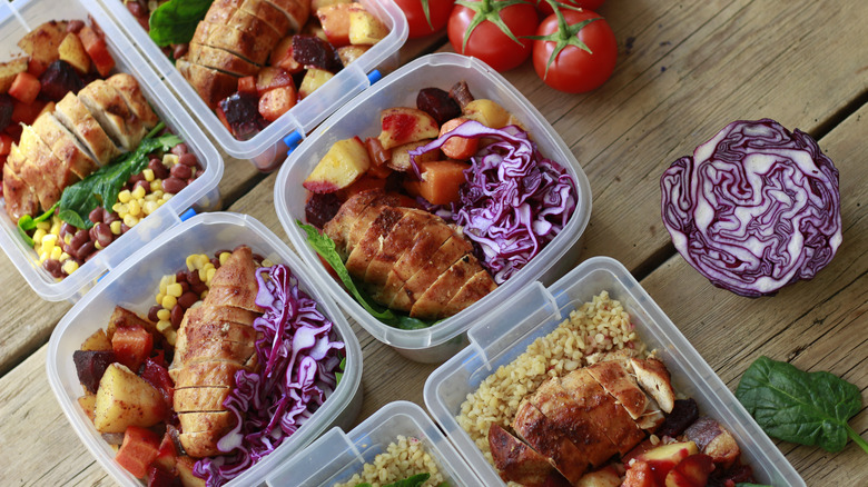 Chicken and veggies are prepped in food containers