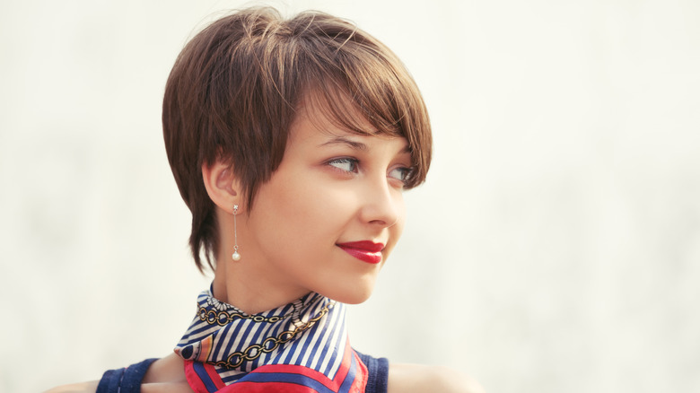 Woman with pixie cut smiling