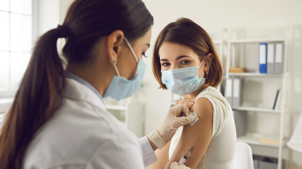 Person receiving COVID vaccine