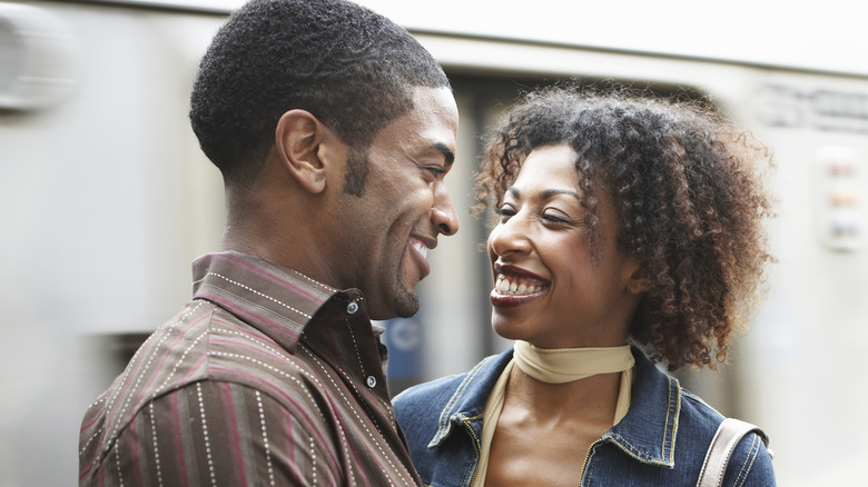 smiling couple making eye contact