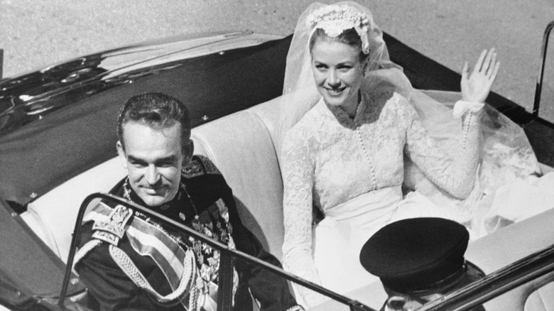 Prince Rainier III and Princess Grace of Monaco in car after wedding