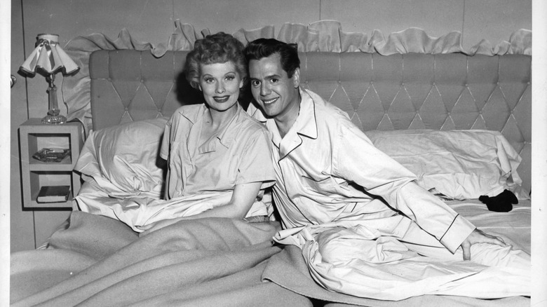 Lucille Ball and Desi Arnaz smiling