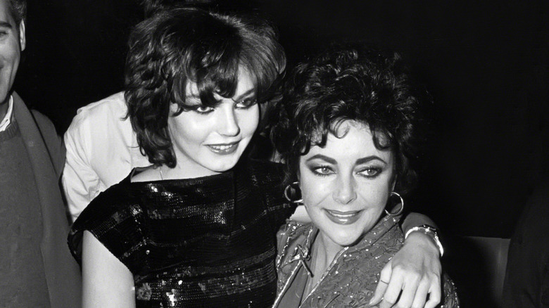 Elizabeth Taylor holding Maria Burton