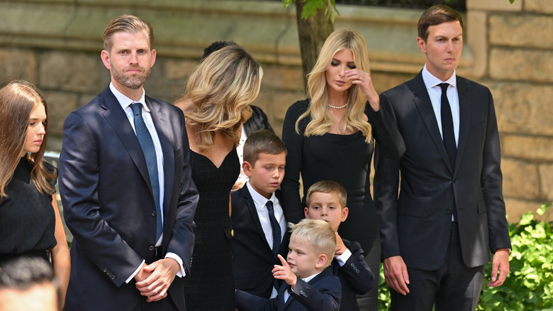 Eric and Lara Trump with family at a funeral