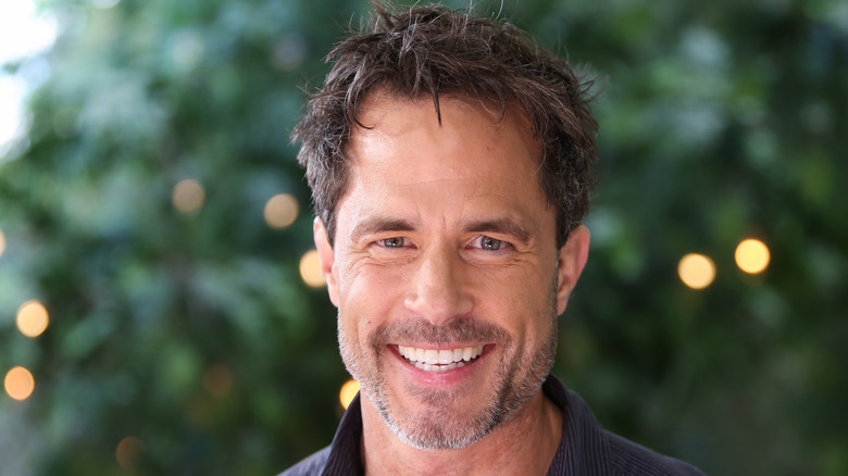 Shawn Christian smiling at an event. 