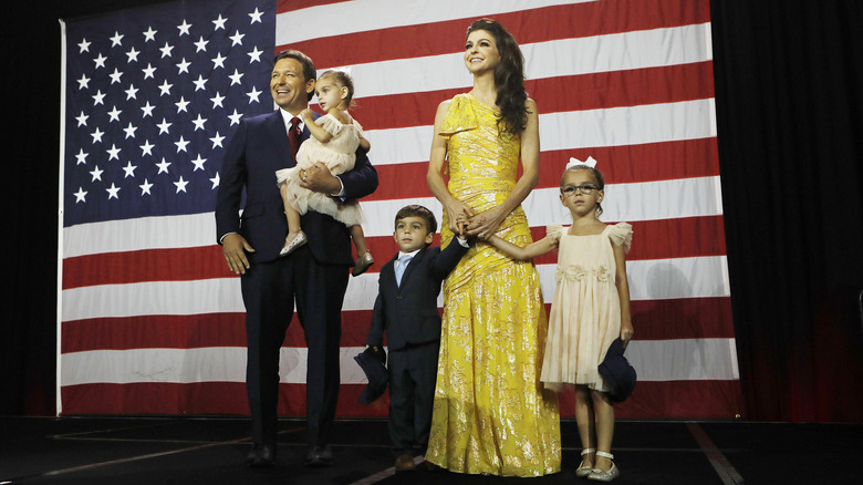 Ron DeSantis holding Mamie, Casey DeSantis holding hands with Mason and Madison