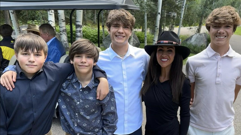 Lauren Boebert standing between sons Tyler and Brody