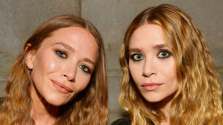 Mary-Kate and Ashley Olsen attend an event