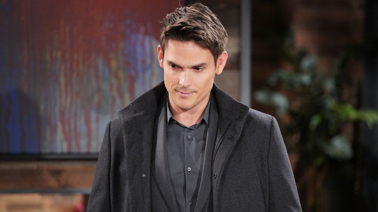 Mark Grossman wears a black coat as Adam Newman on "Y&R"