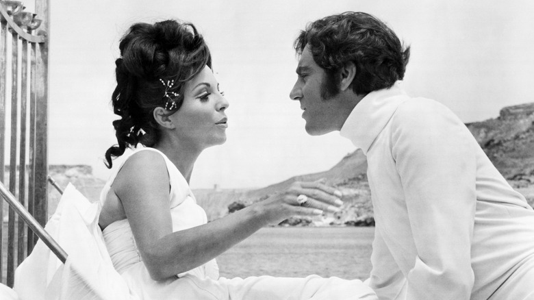 Joan Collins and Anthony Newley talking