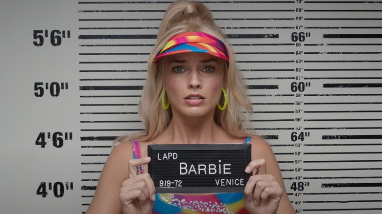 Margot Robbie as Barbie in a mug shot