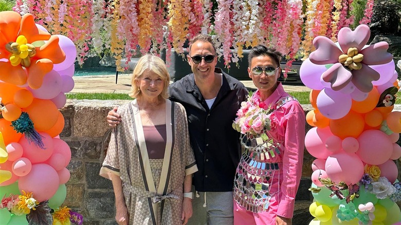 Martha Stewart, Evan Goldstein, and Andy Chia Yu posing party decorations