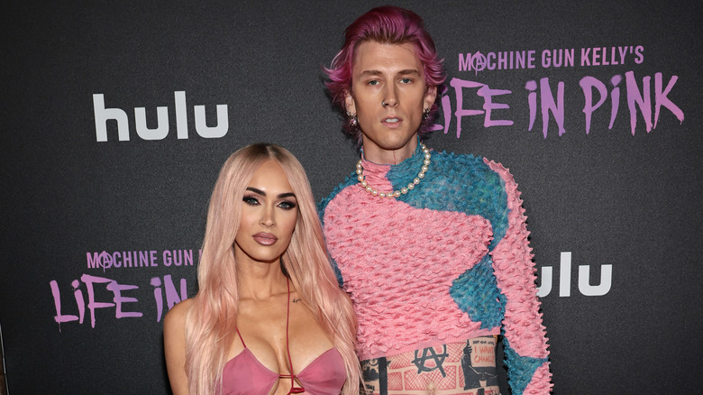 Megan Fox and Machine Gun Kelly wearing matching pink outfits