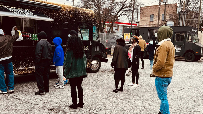 People in line for food trucks at the King Center