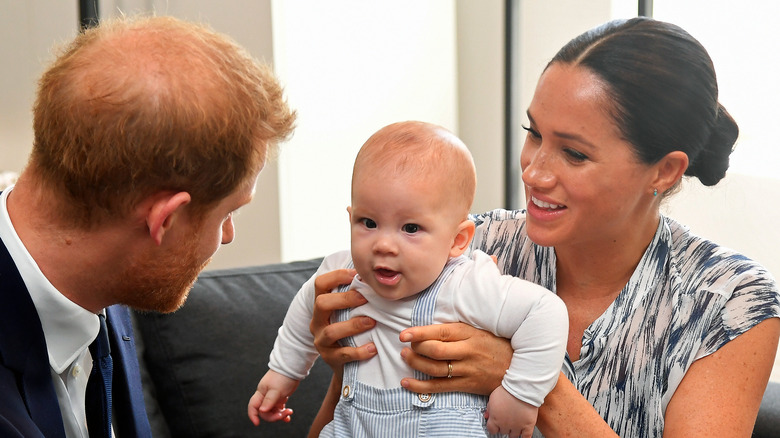 Meghan and Harry play with baby Archie