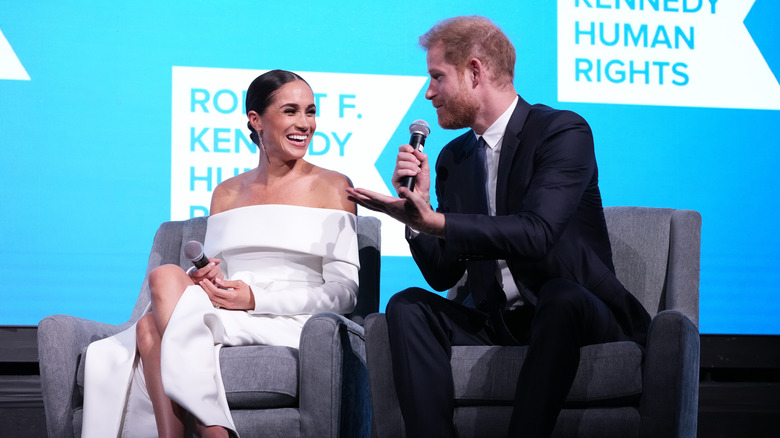 Meghan Markle smiles at an event