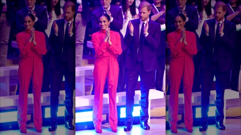 Meghan Markle smiles in red at event