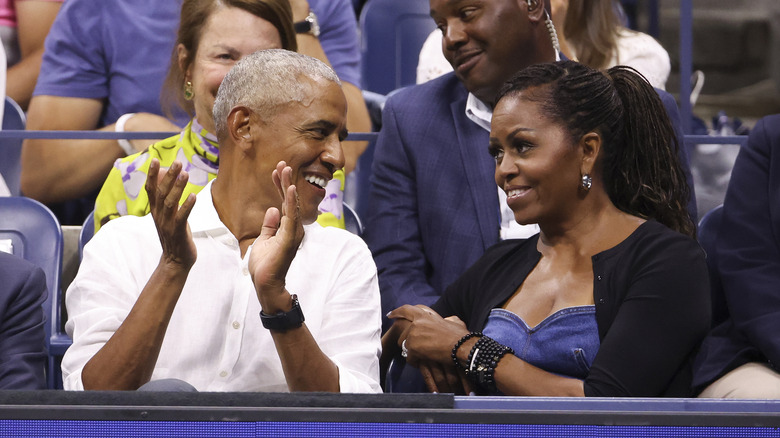 Barack Obama Michelle Obama smiling at each other